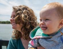 Mother and child: Bonnie Bain and Peyton Massie look into their future during their participation in a demonstration against the Peabody peaker plant. They are the Danversport Bridge, in sight of the designated location of the plant.e